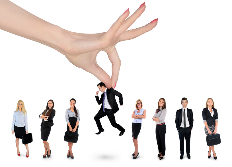 Hand choosing business man Woman hand choosing business man
