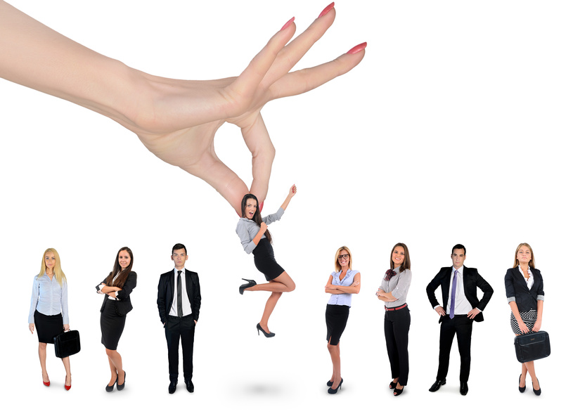 Hand choosing business woman Woman hand choosing business woman
